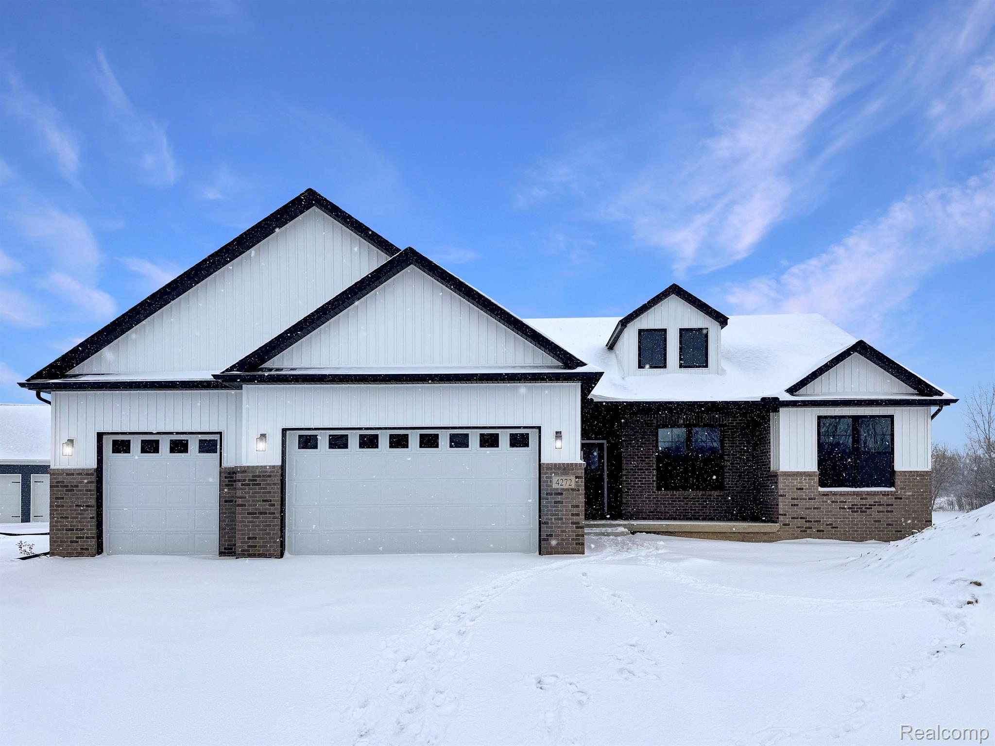 Kensington-built home exterior, snowy daylight