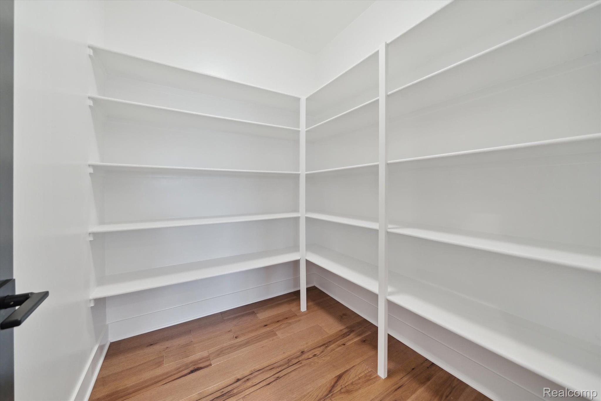 Walk-in pantry with built-in shelving