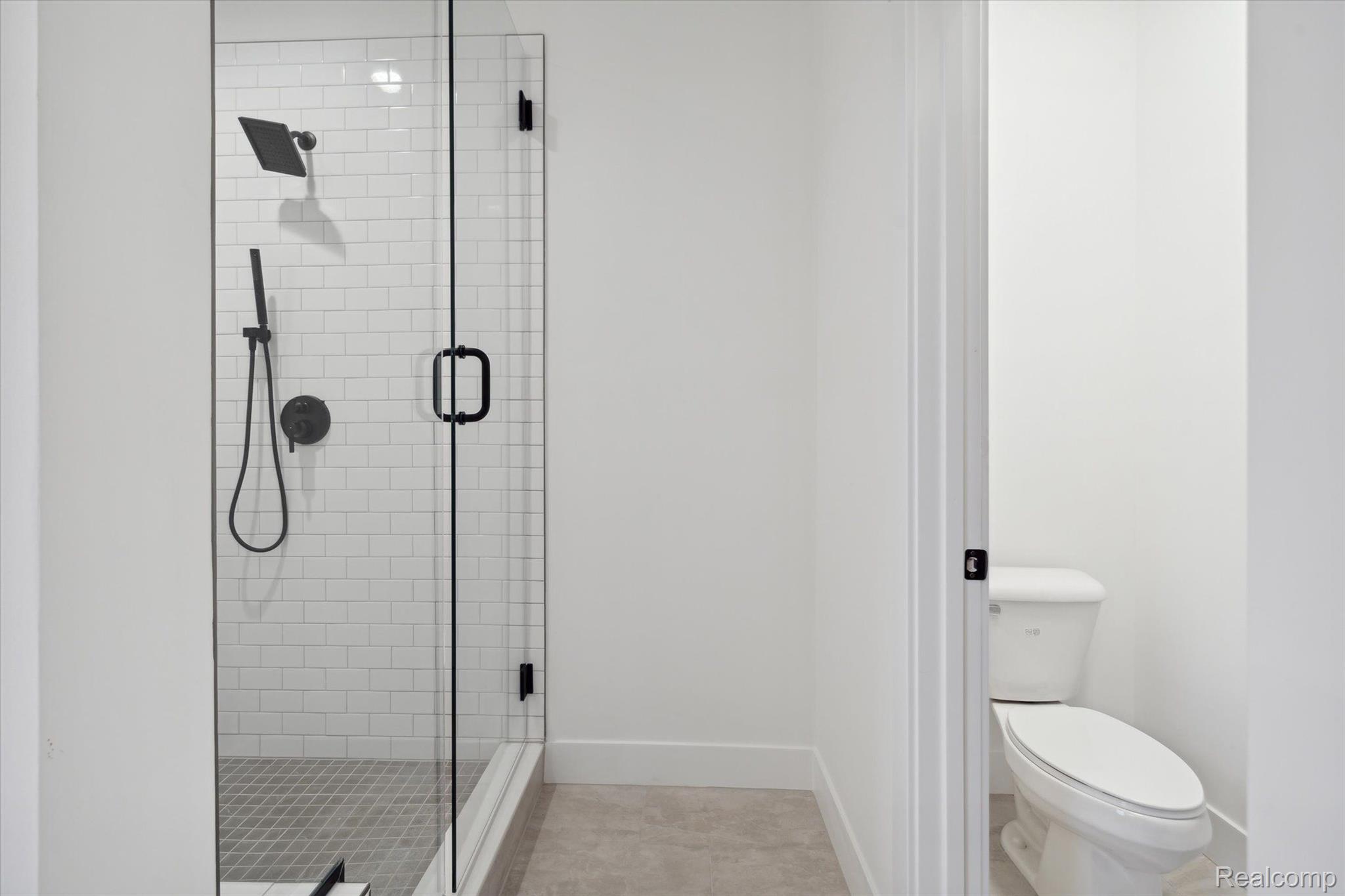 Primary bathroom, walk-in glass shower