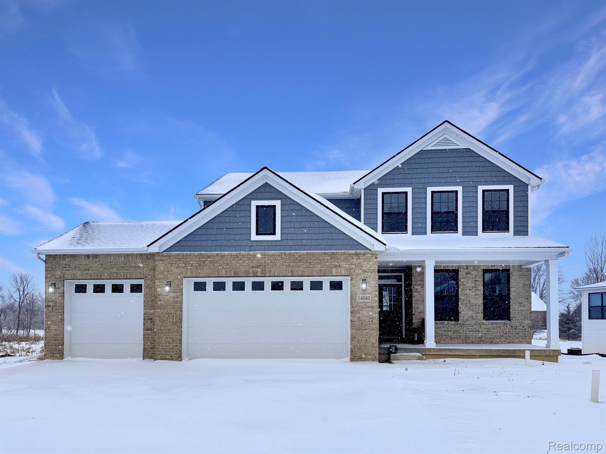 Kensington-built home exterior, slate-blue siding, snowy daylight