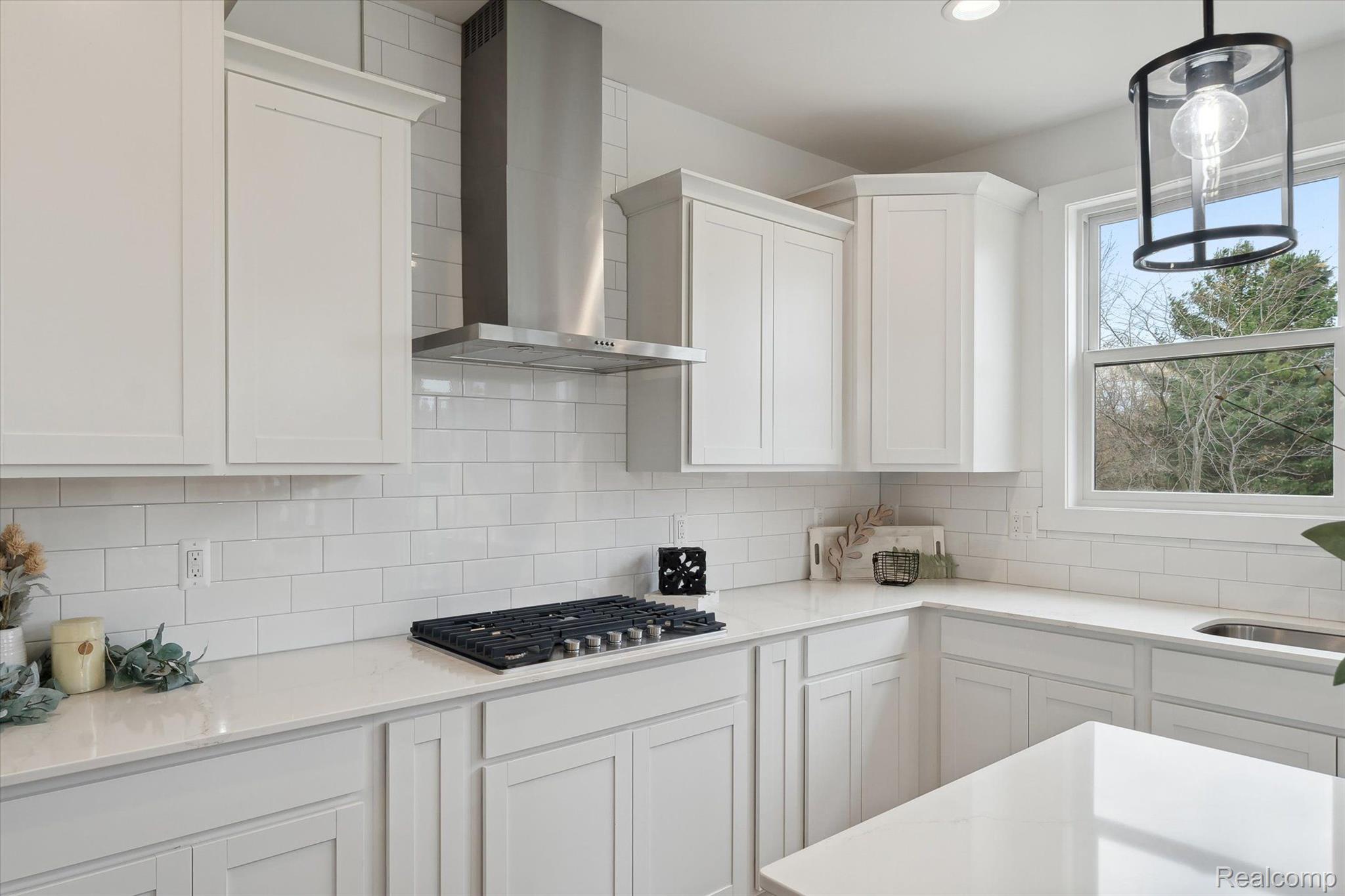 Kitchen cooktop and tile backsplash detail